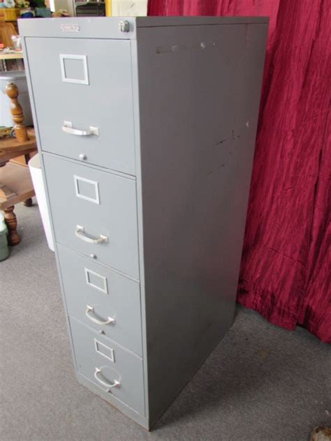 No longer req due to house move £5. Lot Detail - VINTAGE STURDY METAL FOUR DRAWER FILE CABINET