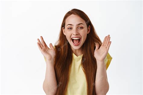 free photo close up of happy laughing redhead woman clap hands and smiling amazed checking
