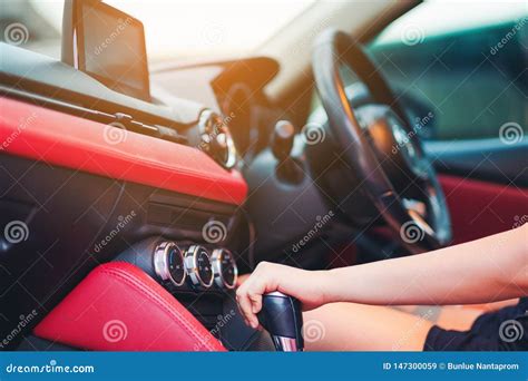 Woman Driving Using A Manual Transmission Stick Shift Close Up Of