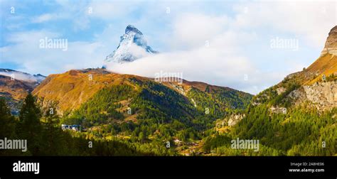 Matterhorn Snow Mountain Peak And Alpine Panorama With Village And Ski