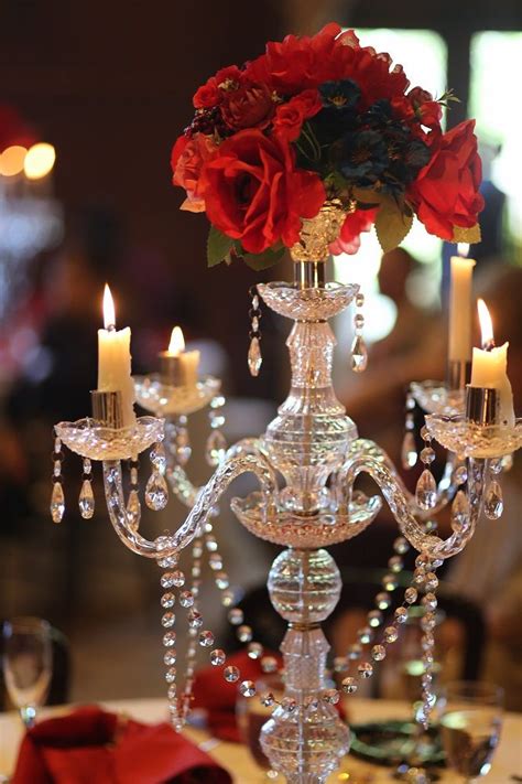 Tall Silver And Crystal Candelabra Centerpiece With Lit Candles And