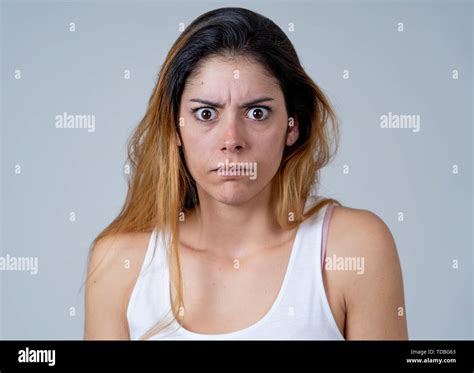 Young Woman Feeling Scared And Shocked Making Fear Anxiety Gestures