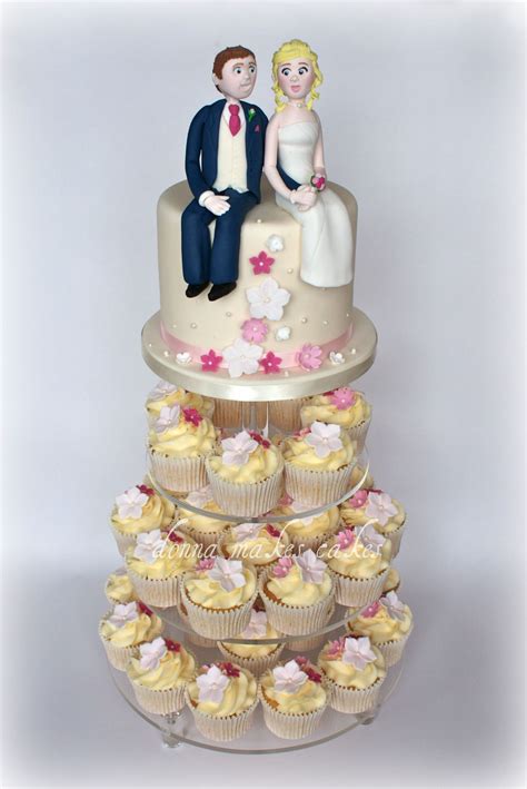 Ivory And Pink Cupcake Tower With Bride And Groom Cupcake Tower