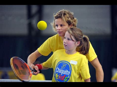 Belgian Tennis Star Kim Clijsters Coaching A Young Player During The