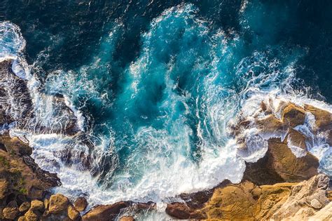 Water Waves Hitting Brown Rocks Hd Wallpaper Peakpx