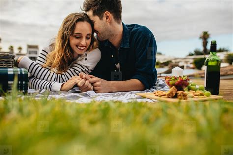 Romantic Couple Out On Picnic Lying On The Ground Stock Photo 160199