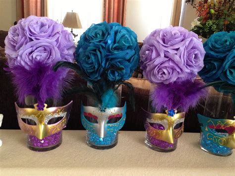 having alternating tall and short center pieces makes the room look larger… masquerade party