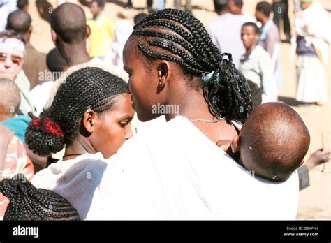 Africa Ethiopia Lalibela Woman With Plaited Hair And Baby On Back Stock