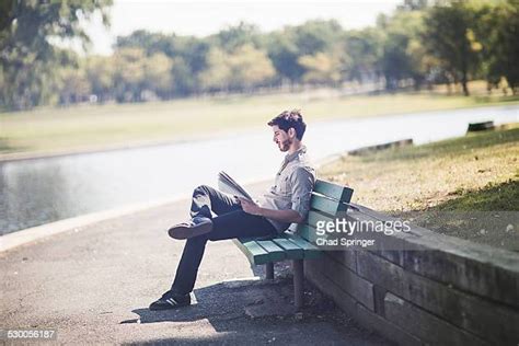Reading On Park Bench Photos And Premium High Res Pictures Getty Images