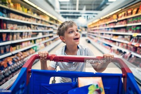 Stock Photo Little Boy Doing Big Shopping In A Supermarket Little