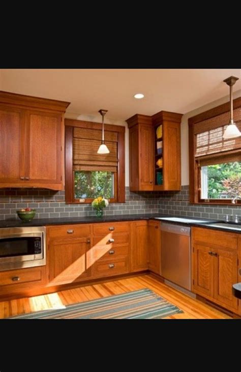 Maybe replace soffits with little cabinets above and glass doors. Cabinet and floor contrast. | Craftsman kitchen, Oak ...