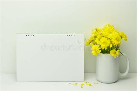 Frame Mockup Blank Calendar With Yellow Flowers In Vase Stock Photo