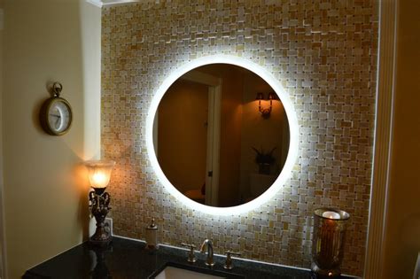 In compact bathrooms, a lighted vanity mirror allows you to accomplish two tasks at once by providing reflection for description: MAM2D32-32" Round side lighted vanity mirror - wall ...