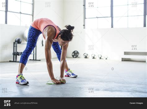 Female Athlete Bending While Exercising With Jumping Rope In Gym Stock Photo Offset