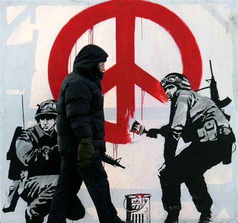 Banksy Artwork Self Destructs Moment After 1 4 Million Sale PBS NewsHour