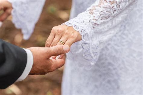 Newlywed Couple In Love Hands Holding Hands Lovingly Showing Their Wedding Rings Stock Image