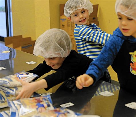 For Feed My Starving Children volunteers, the work 'makes you feel good' - Mundelein Review