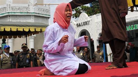 Woman Publicly Caned In Indonesia For Being In Close Proximity To A Man Who Was Not Her Spouse