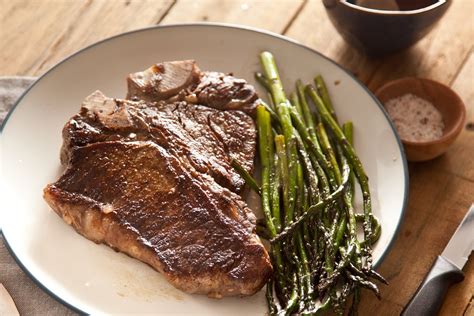 Rub the steak with oil, and then season with salt and pepper on both sides. How to Season T-Bone Steaks (with Pictures) | eHow