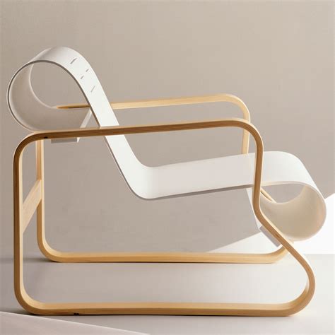 Through the 1930s the finnish architect alvar aalto designed a number of chairs that had a shaped seat in plywood. Artek Alvar Aalto 41 - Paimio Scroll Chair - Artek Lounge ...