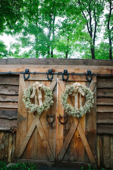 babies breath wreaths on barns door at Seven Springs | Barn door wedding, Babys breath, Babys 