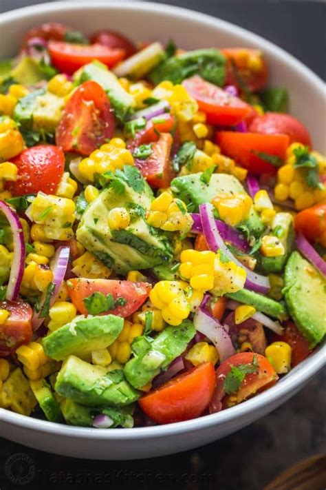 Chop cilantro and place in a large salad bowl with previous ingredients. Avocado Corn Salad (VIDEO) - NatashasKitchen.com