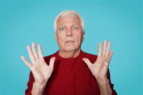 Elderly Man With Expression Of Amazement On Blue Background Stock Image