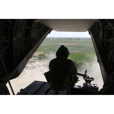 A Us Marine Corps Door Gunner Aboard An Mv 22 Osprey Poster Print