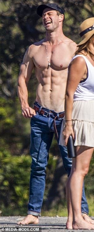 chris and liam hemsworth shows off their ripped bodies after morning surf
