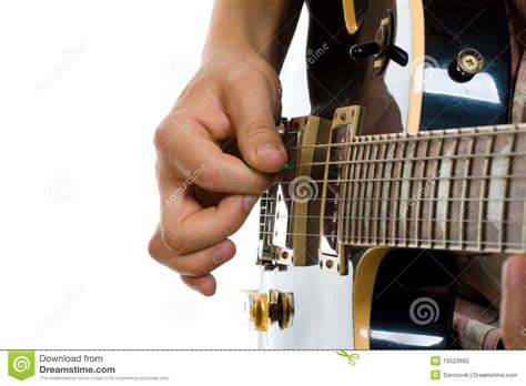 Poor technique can injure you as you begin to play faster and more. How To Hold Guitar Pick Stock Photography - Image: 10523682