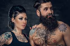 tattooed portrait couple grey studio dark body background over twitter