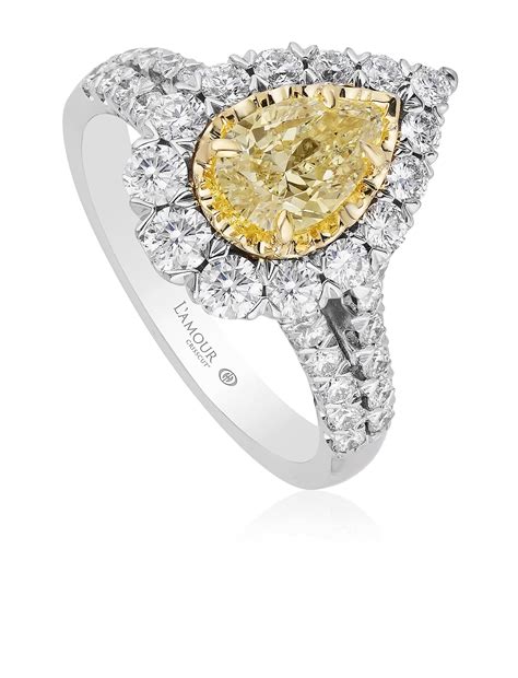 Yellow Diamond Pear Shaped Engagement Ring With Halo And Diamond Set