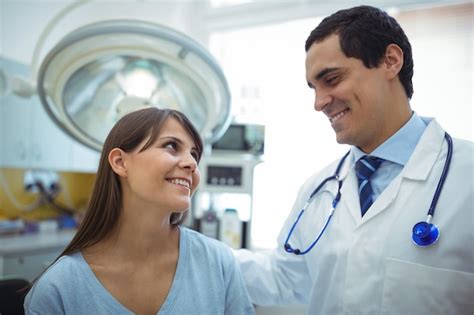 Premium Photo Female Patient Interacting With Doctor During Visit