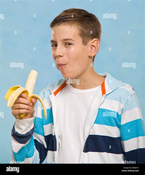 Boy Eating Banana Stock Photo Alamy