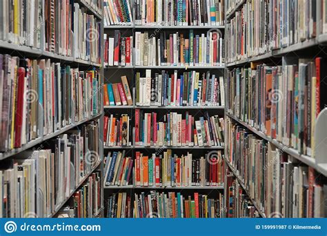 Various Books On Shelves At A Library Editorial Photography Image Of