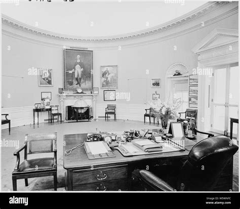 Photograph of the Oval Office, as seen from behind President Truman's