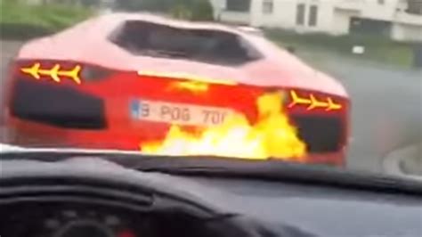 Watch This Lambo Shoot Flames All Over A Ferraris Hood The Drive
