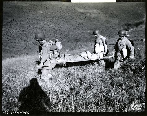 Wounded Soldier Being Carried From Battle Zone During Maneuvers Near