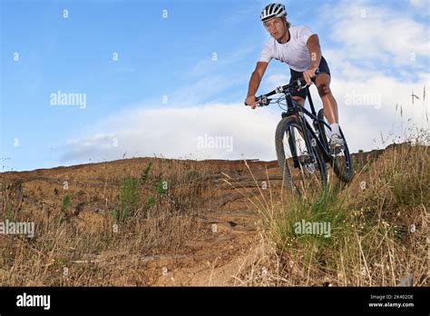 Nothing Beats An Extreme Bike Ride Fit Cyclist Riding Across Rough Terrain While Out In Nature
