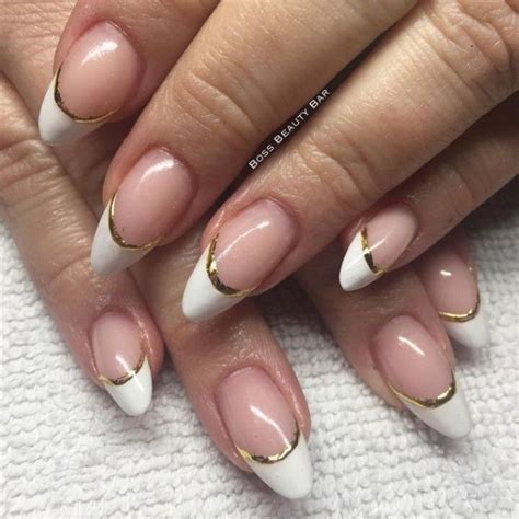French Manicure With Gold Details On Two Pale Hands With Medium To Short Pointy Nails Acrylic