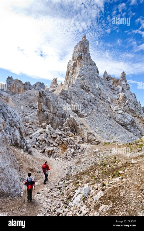 Climbers Crossing The Latemar Massif Fixed Rope Route Dolomites In