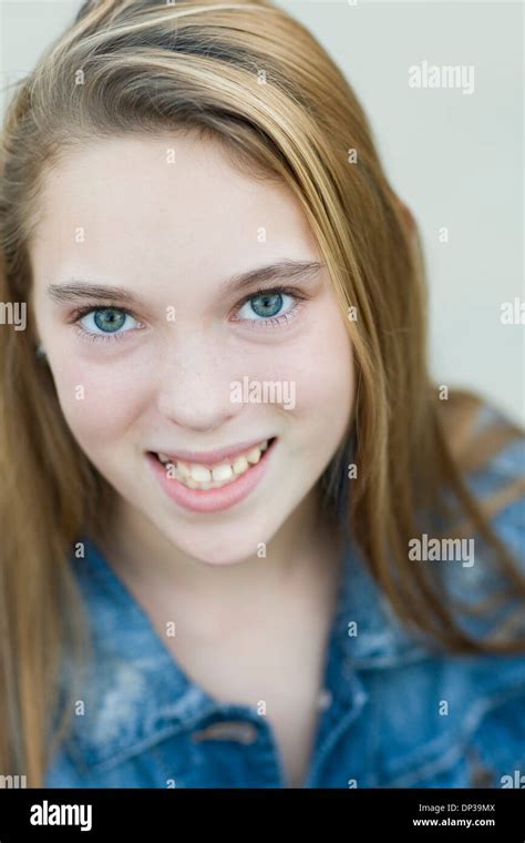Close Up Portrait Of Pre Teen Girl Smiling And Looking At Camera Stock