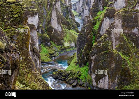 Fjadrargljufur Canyon With Rocks Mountains And River On Iceland Stock