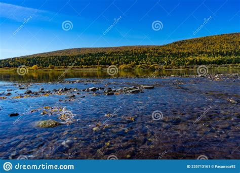 Lena River Bank In Siberia Shallow Shore With Rocks And Hills With