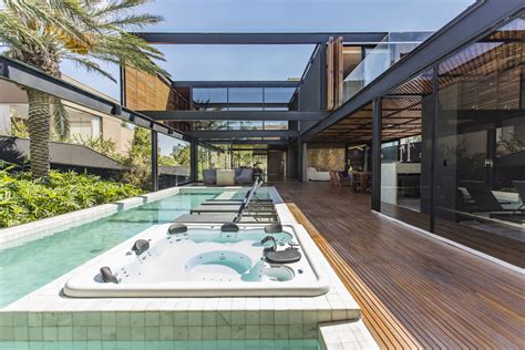 Modern Residence In Brazil Features Stones Wood Glass And Metal