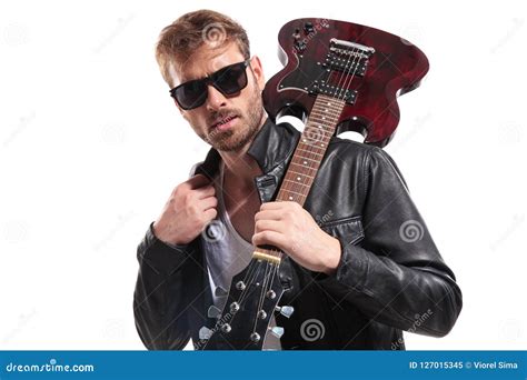 Guitarist Wearing Sunglasses Holds Guitar On Shoulder Stock Image