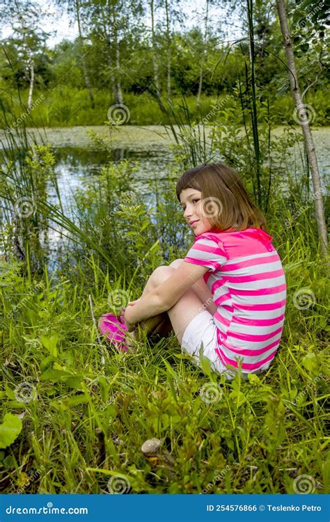 A Happy Little Girl Near The Pond In Forest Stock Photo Image Of