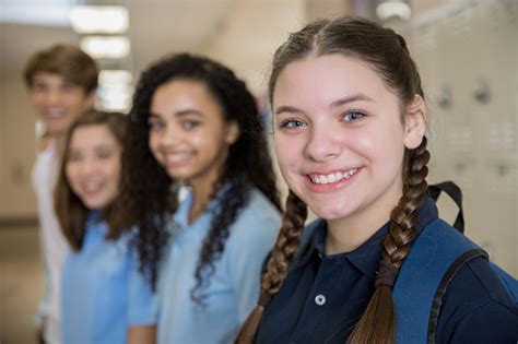 Happy High School Students Smiling By Lockers Stock Photo Download