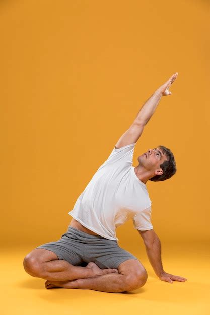 Man Practicing Yoga Pose Free Photo