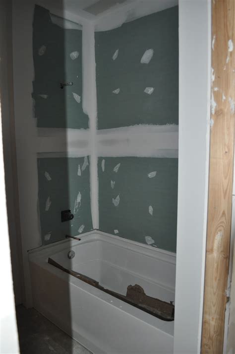 You want to install your cement board using as big boards as possible. Can I Put Sheetrock Above a Shower Surround Wall? | Bathroom